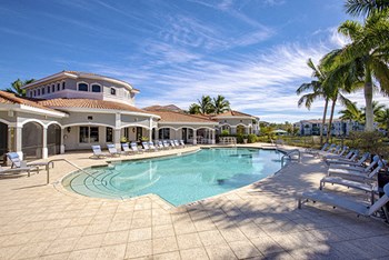 Pool Side Relaxing Area With Sundeck at Sierra Grande Apartments, Naples, Florida